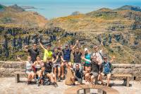 a group of people posing for a picture at the grand canyon at Never at Home Kloof Street in Cape Town