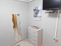 Televízia a/alebo spoločenská miestnosť v ubytovaní Appartement a louer a Torrevieja 100m de la plage