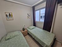 Posteľ alebo postele v izbe v ubytovaní Appartement a louer a Torrevieja 100m de la plage