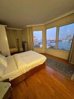 Postel nebo postele na pokoji v ubytování Royal Nile view 2BR