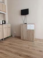 TV a/nebo společenská místnost v ubytování Sunlight Studio