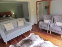 a living room with a couch and a chair at Caledon 31 in George