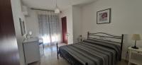 Posteľ alebo postele v izbe v ubytovaní White Apartment