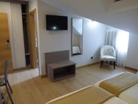 TV a/nebo společenská místnost v ubytování Hotel Mercedes