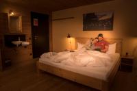 A bed or beds in a room at alpen select lodge Kleinwalsertal