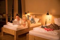 A bed or beds in a room at alpen select lodge Kleinwalsertal