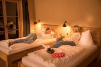 A bed or beds in a room at alpen select lodge Kleinwalsertal