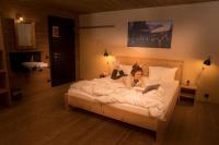 A bed or beds in a room at alpen select lodge Kleinwalsertal