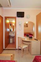Telewizja i/lub zestaw kina domowego w obiekcie Hotel Arlecchino