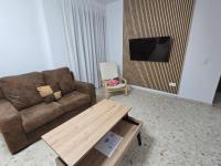 Televízia a/alebo spoločenská miestnosť v ubytovaní Apartamentos Casa Sardina