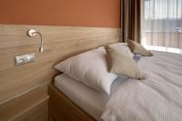Posteľ alebo postele v izbe v ubytovaní Hotel Havrania