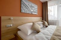 Posteľ alebo postele v izbe v ubytovaní Hotel Havrania