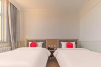 Beijing Watermelon Journey Hotel - Daxing Airportにあるベッド
