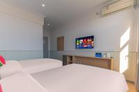 Beijing Watermelon Journey Hotel - Daxing Airportにあるベッド