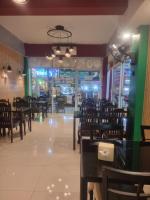 En restaurant eller et andet spisested på Noorjahan Guesthouse Pattaya