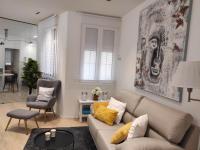 Posezení v ubytování Lujoso y amplio apartamento con parking incluido