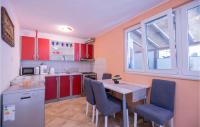 Kuchyň nebo kuchyňský kout v ubytování One-Bedroom Holiday Home With Sea View In Makarska