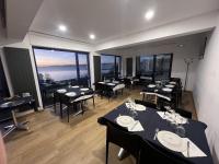 Reštaurácia alebo iné gastronomické zariadenie v ubytovaní hotel la trainera
