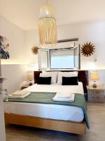 Postel nebo postele na pokoji v ubytování Del Sol Suites