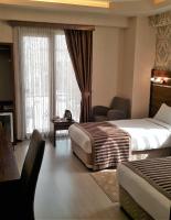 A bed or beds in a room at My Liva Hotel