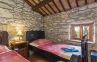 Postel nebo postele na pokoji v ubytování One-Bedroom Holiday Home In Labin
