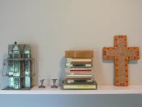 a shelf with books and a cross on it at Caledon 31 in George