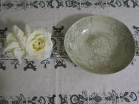 a green vase with a white rose on a table at Caledon 31 in George