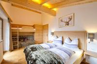 Posteľ alebo postele v izbe v ubytovaní Superior Chalet Tiroler Madl