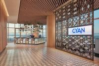 a lobby with a bar with a bunch of wine bottles at Lanson Place Mall of Asia Manila in Manila