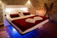 A bed or beds in a room at Inferno e Paradiso