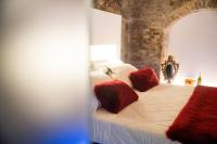 A bed or beds in a room at Inferno e Paradiso