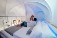 A bed or beds in a room at Inferno e Paradiso