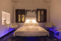 A bed or beds in a room at Inferno e Paradiso