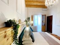 a living room with a large vase on the wall at Atrium in Castellammare del Golfo
