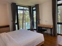 Ein Bett oder Betten in einem Zimmer der Unterkunft Lan Anh Villas Resort