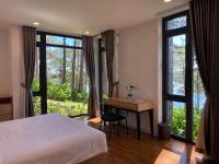 Ein Bett oder Betten in einem Zimmer der Unterkunft Lan Anh Villas Resort