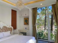 Ein Bett oder Betten in einem Zimmer der Unterkunft Lan Anh Villas Resort