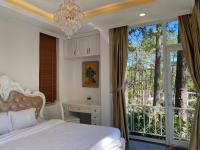 Ein Bett oder Betten in einem Zimmer der Unterkunft Lan Anh Villas Resort
