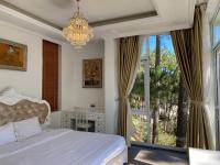 Ein Bett oder Betten in einem Zimmer der Unterkunft Lan Anh Villas Resort