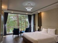 Ein Bett oder Betten in einem Zimmer der Unterkunft Lan Anh Villas Resort