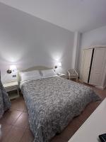 Łóżko lub łóżka w pokoju w obiekcie Hotel Terranova