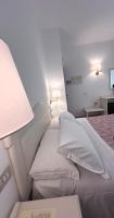 Łóżko lub łóżka w pokoju w obiekcie Hotel Terranova