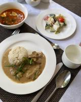 a table with plates of food and bowls of soup at CasaBrava at RadugaWest in Koshkolʼ