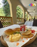 a plate of food with bread and pastries on a table at CasaBrava at RadugaWest in Koshkolʼ