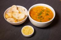 two bowls of soup and chips and a bowl of rice at Hotel Uipi in Sorriso