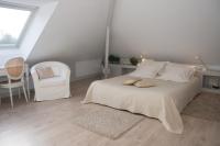 Postel nebo postele na pokoji v ubytov&aacute;n&iacute; Villa Flore Chambres d&#39;Hotes