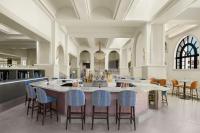 a large kitchen with a large island with bar chairs at The Westin La Paloma Resort & Spa in Tucson