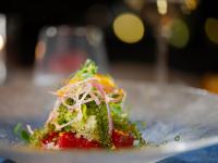 a plate with a piece of food on a table at Jusandi in Ishigaki Island