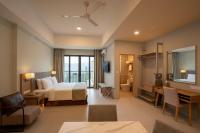 Ein Bett oder Betten in einem Zimmer der Unterkunft Zenith Suites Cameron