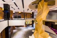 a view of the lobby of a building with a wooden wall at The Tree House in Kaohsiung